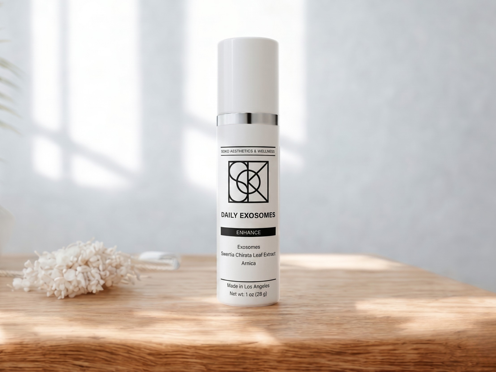 Dermal Reboot treatment bottle on wooden table with natural light, premium Soko exosomes skincare for post-procedure recovery, redness relief, barrier repair, firmness and radiance