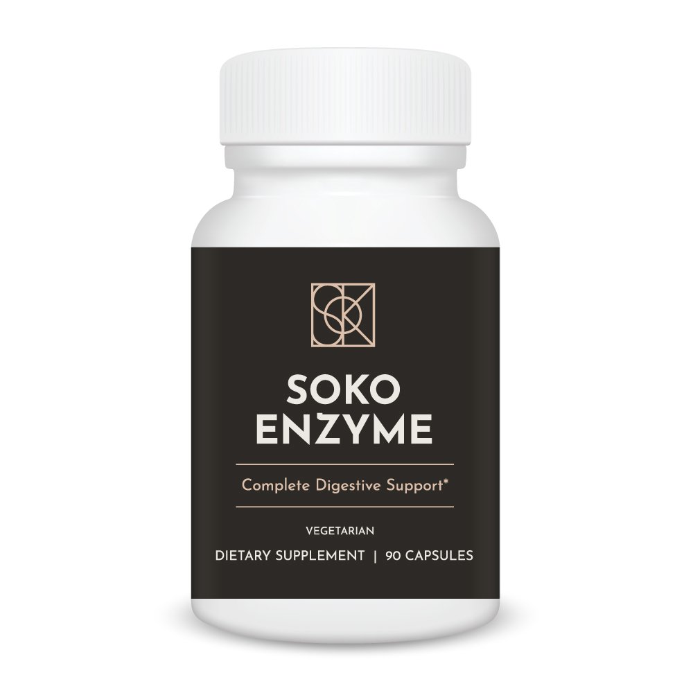 Soko Enzyme supplement bottle on wooden table with natural light, premium broad spectrum digestive enzymes with amylase protease lipase for protein fat carb digestion and nutrient absorption support
