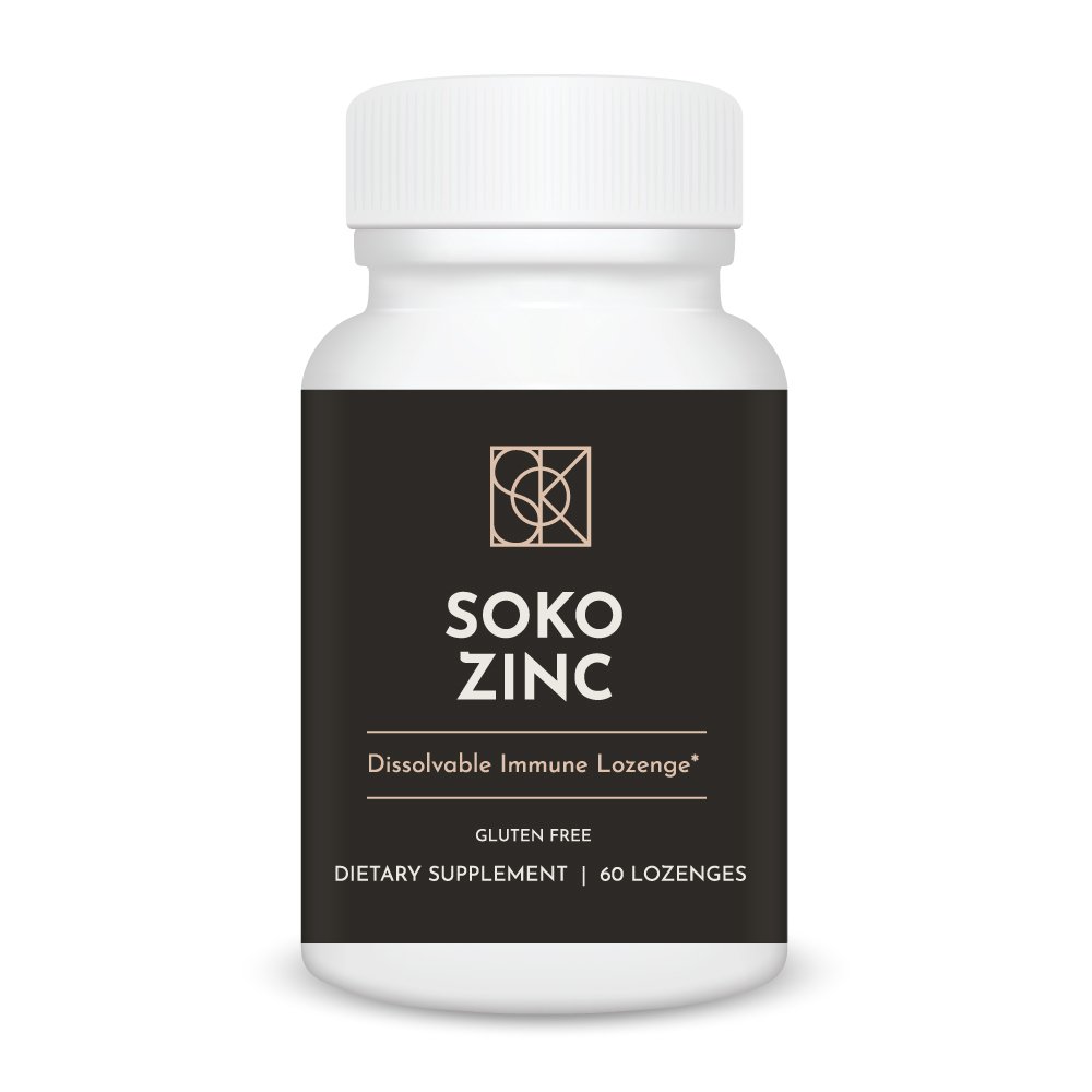 Soko Zinc lemon lozenges on wooden table with natural light, premium zinc citrate and gluconate supplement for immune support, skin health, collagen production and throat comfort